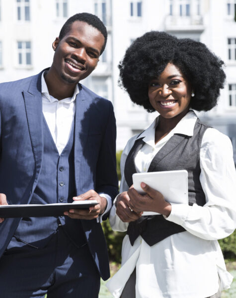 portrait-african-young-businessman-businesswoman-holding-clipboard-digital-tablet-looking-camera